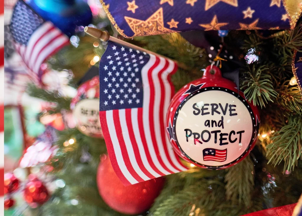 Christmas tree with patriotic ornaments including a "Serve and Protect" Christmas ball.