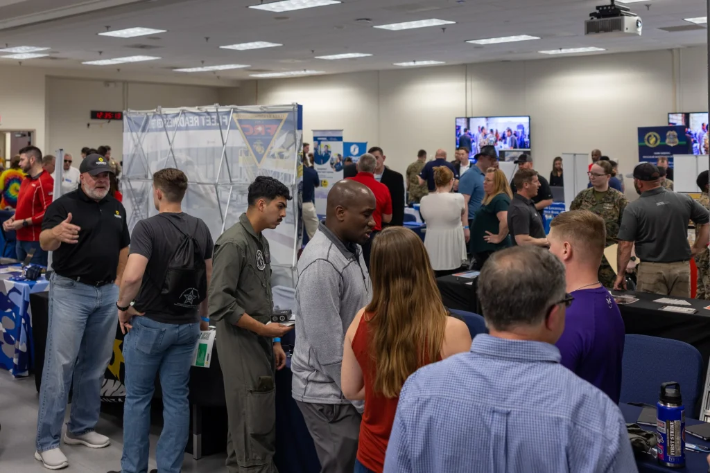 Veterans job fair with several veterans looking for work and in the process of being hired.