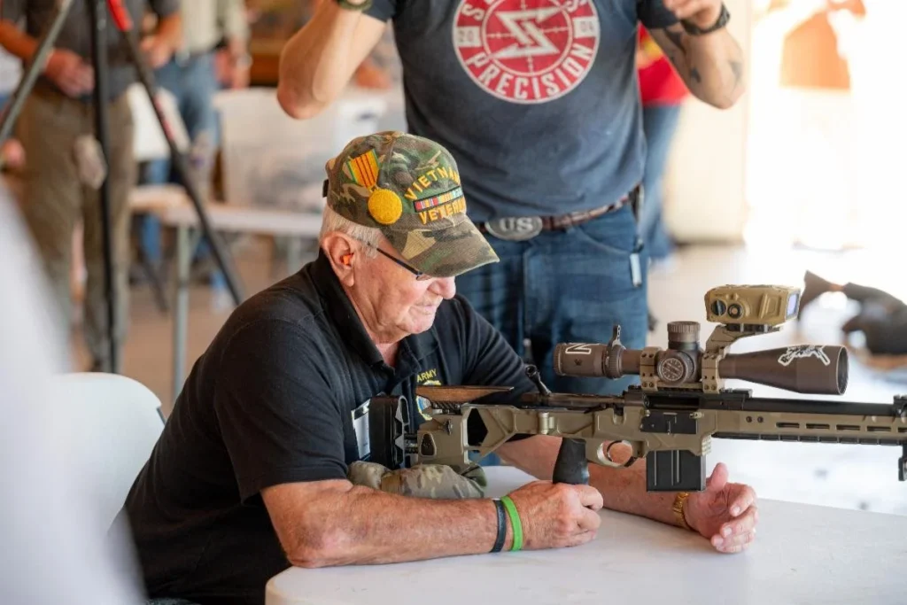A military veteran participates in the Bullets, Bourbon and Barbeque event.