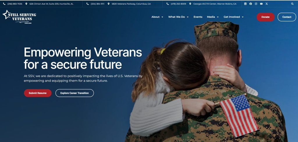 Hero image showing a U.S. service member in uniform holding a child with an American flag, representing support for veterans and their families.