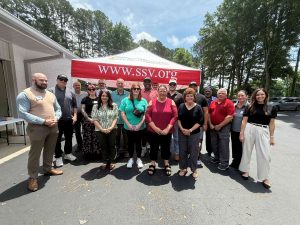 SSV team members standing outside with the Havoc food truck.